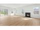 Open concept living room features a fireplace, recessed lighting, and multiple windows at 313 Mason Oaks Dr, Wake Forest, NC 27587