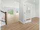 Spacious living area leading to bright adjoining rooms with light streaming through doors at 313 Mason Oaks Dr, Wake Forest, NC 27587