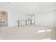Large carpeted loft area with recessed lighting, staircase railing, and views from surrounding windows at 313 Mason Oaks Dr, Wake Forest, NC 27587