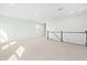 Spacious carpeted loft area with recessed lighting and views from multiple windows at 313 Mason Oaks Dr, Wake Forest, NC 27587
