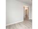 En suite bathroom with tiled floor, bright chandelier and view of a toilet at 499 Glenkirk Pl # 101, Garner, NC 27529