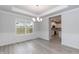 Spacious dining room with hardwood floors and wainscoting at 499 Glenkirk Pl # 101, Garner, NC 27529