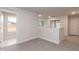 A neutral hallway with carpet and white walls leads to other rooms at 499 Glenkirk Pl # 101, Garner, NC 27529