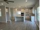 Spacious kitchen and living area features white cabinets, modern appliances, and an open layout at 499 Glenkirk Pl # 101, Garner, NC 27529