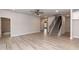 Spacious living room with a staircase, light-colored walls, and a ceiling fan at 499 Glenkirk Pl # 101, Garner, NC 27529