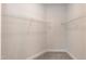Walk-in closet featuring gray walls and carpet and white wire shelving at 499 Glenkirk Pl # 101, Garner, NC 27529