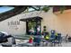 A charming bakery exterior with outdoor seating and a visible flower display through the glass door at 704 Chatham View Rd # 12, Cary, NC 27511