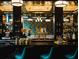 Elegant bar area with liquor selection, modern lighting, and bar seating at 704 Chatham View Rd # 12, Cary, NC 27511