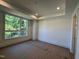 Bright bedroom with large window showcasing tree-filled scenery at 704 Chatham View Rd # 12, Cary, NC 27511