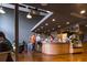 A modern coffee shop with patrons at the counter, menus, and ample seating in a well-lit space at 704 Chatham View Rd # 12, Cary, NC 27511