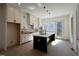 Bright kitchen with a large island, stainless appliances, white cabinets and subway tile backsplash at 704 Chatham View Rd # 12, Cary, NC 27511