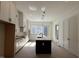 Open kitchen design with a central island, modern lighting and sleek appliances at 704 Chatham View Rd # 12, Cary, NC 27511
