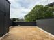 Outdoor patio with wood tile and view of trees in the distance at 704 Chatham View Rd # 12, Cary, NC 27511