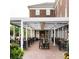 The outdoor seating area features a beautiful brick patio with a pergola and plenty of tables and chairs at 704 Chatham View Rd # 12, Cary, NC 27511
