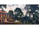 Inviting outdoor event space with lighting, greenery, and tables for relaxation and socializing at 704 Chatham View Rd # 12, Cary, NC 27511