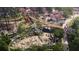 Aerial view of a colorful playground with slides, bridges, and a water play area at 704 Chatham View Rd # 12, Cary, NC 27511