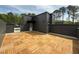 Private rooftop deck features custom wood tiles and an open-air setting at 704 Chatham View Rd # 12, Cary, NC 27511