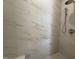 Shower featuring marble-look tile with shower head and controls at 704 Chatham View Rd # 12, Cary, NC 27511