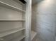Bright shower showcasing marble-look tile and built-in shelves for a spa-like experience at 704 Chatham View Rd # 12, Cary, NC 27511