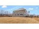 New construction features a large backyard, siding, windows, and construction debris at 1125 Brookfield Dr, Gibsonville, NC 27249