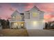 Beautiful two-story home featuring a two-car garage, covered porch, and lovely, neutral color palette at 1125 Brookfield Dr, Gibsonville, NC 27249
