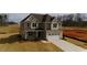 A beautiful 2-story home with a 2-car garage and manicured landscaping offers modern curb appeal at 1125 Brookfield Dr, Gibsonville, NC 27249