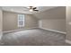 Spacious bonus room featuring carpet and natural light, ideal for your home office or play room at 1129 Brookfield Dr, Gibsonville, NC 27249