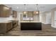 Kitchen featuring an island, stainless appliances, and pendant lighting at 1129 Brookfield Dr, Gibsonville, NC 27249
