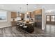 Spacious kitchen featuring an island with bar seating, stainless steel appliances, and pendant lighting at 1129 Brookfield Dr, Gibsonville, NC 27249
