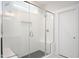 Large walk-in shower with glass enclosure and gray tile at 1213 Porters Call Dr # 2261, Wendell, NC 27591