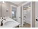 This bathroom includes a double sink vanity, a tub-shower combo, and neutral wall and floor tones at 1129 Brookfield Dr, Gibsonville, NC 27249