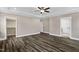 Spacious bedroom featuring wood-look flooring and a modern ceiling fan with a light at 1129 Brookfield Dr, Gibsonville, NC 27249