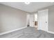A well-lit bedroom boasts neutral walls, carpeted floors, and doorways leading to other rooms at 1129 Brookfield Dr, Gibsonville, NC 27249