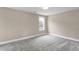 Neutral bedroom offering a bright window and plush carpet at 1129 Brookfield Dr, Gibsonville, NC 27249