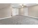 Finished bonus room with neutral carpeting and base trim at 1129 Brookfield Dr, Gibsonville, NC 27249