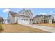 Charming two-story home with a two car garage, and long driveway at 1129 Brookfield Dr, Gibsonville, NC 27249