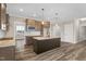 Spacious kitchen featuring an island with seating and granite countertops at 1129 Brookfield Dr, Gibsonville, NC 27249