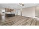 Open concept living space featuring hardwood floors, and a kitchen island at 1129 Brookfield Dr, Gibsonville, NC 27249