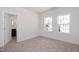 Bedroom with two windows and a view of the neighborhood at 197 Beacon Dr, Pittsboro, NC 27312