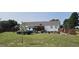 Expansive backyard featuring a gazebo, spacious lawn, privacy fence, and convenient off-street parking at 3027 Nc Highway 210, Smithfield, NC 27577