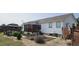 Spacious backyard featuring a deck, gazebo, and mature landscaping, ideal for outdoor living and entertaining at 3027 Nc Highway 210, Smithfield, NC 27577