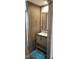 The bathroom has a wood cabinet sink and a large mirror at 3027 Nc Highway 210, Smithfield, NC 27577
