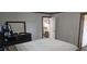This bedroom features a nice dresser and access to other parts of the home at 3027 Nc Highway 210, Smithfield, NC 27577