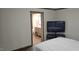 This bedroom features an adjoined bath and a flat screen tv at 3027 Nc Highway 210, Smithfield, NC 27577