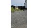 Home featuring mature trees, gravel areas, and space for parking at 3027 Nc Highway 210, Smithfield, NC 27577