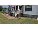 Beautifully landscaped front yard with brick accents leading to the home's entrance at 3027 Nc Highway 210, Smithfield, NC 27577