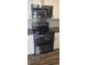 This kitchen has a range and microwave with stainless steel finishes at 3027 Nc Highway 210, Smithfield, NC 27577