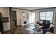 Cozy living room featuring a fireplace, wood floors, and comfortable seating at 3027 Nc Highway 210, Smithfield, NC 27577