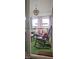 Relaxing screened porch with cozy seating, accent pillows, stylish lighting, and plenty of room to relax at 3027 Nc Highway 210, Smithfield, NC 27577