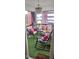 Relaxing screened porch with comfortable seating, accent pillows, and a stylish light fixture at 3027 Nc Highway 210, Smithfield, NC 27577
